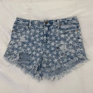 Star print high waisted jean shorts with ripped fringe him